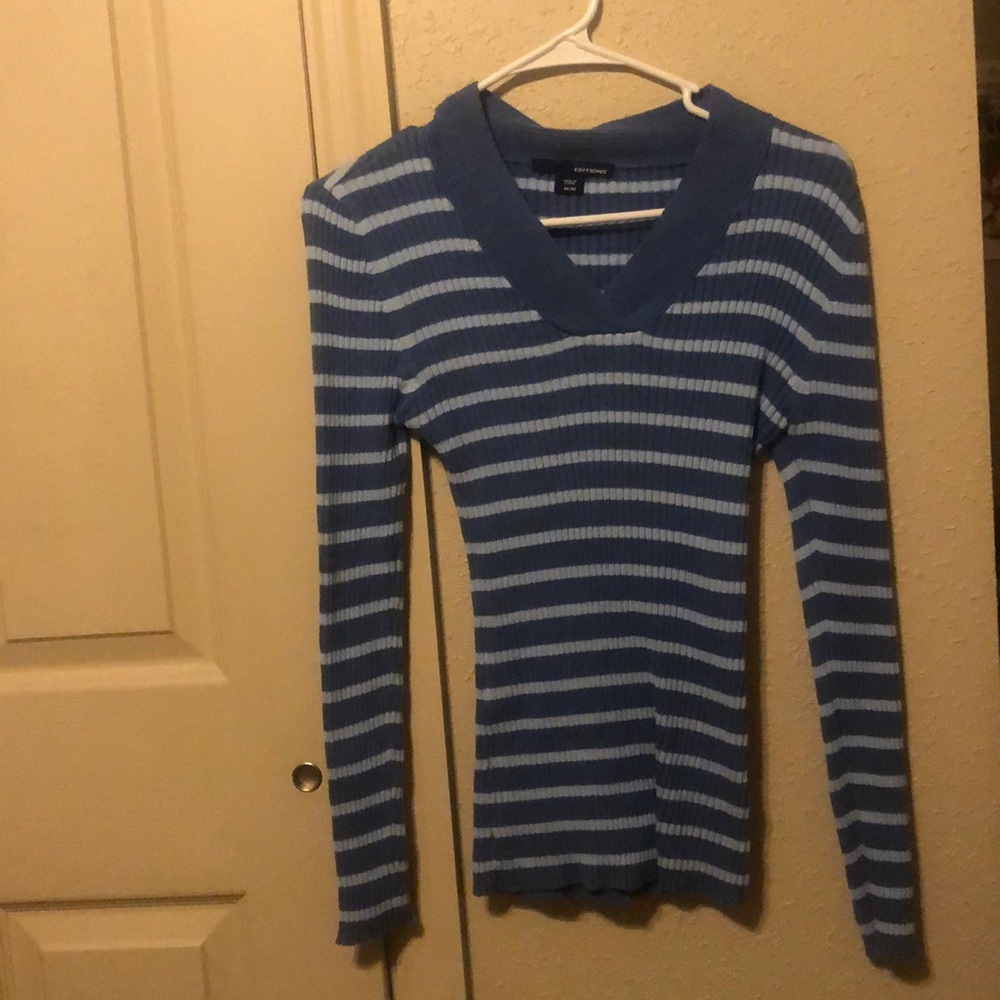A dark and light blue long sleeved shirt.